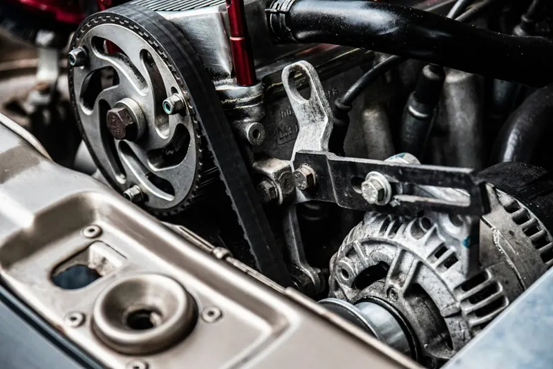 Timing belt and pulleys on the side of an engine